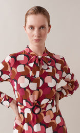 Redcliffe luxurious pure Italian silk crepe de chine belted neck tie long sleeve midi shift dress in rhubarb red, berry and crème ivory white graphic geometric print