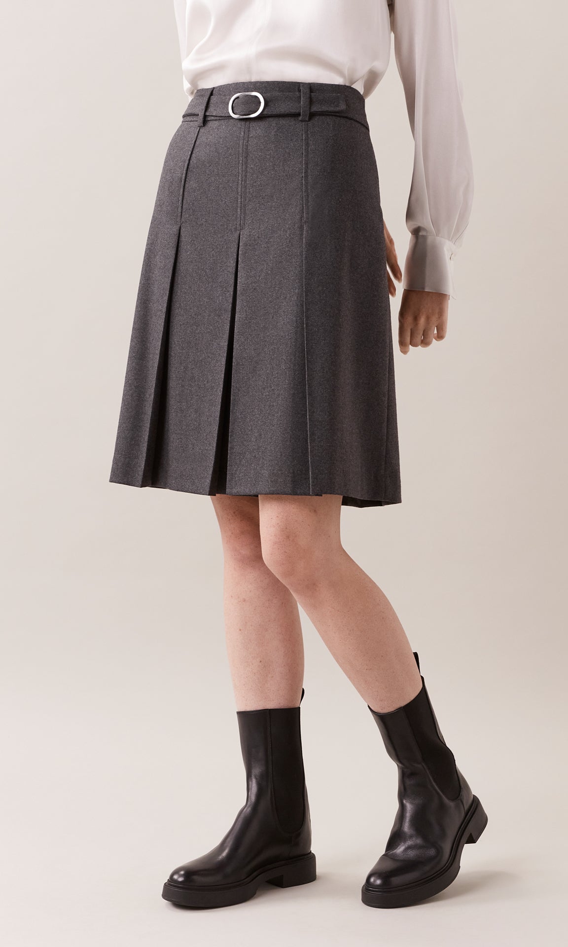 Romsey luxurious Italian wool blend mélange flannel belted high waist pleated knee length skirt with topstitch detailing in charcoal grey
