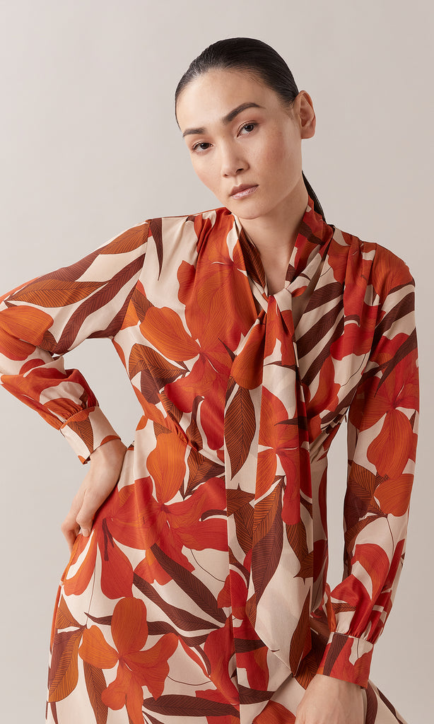 Mirabello luxurious pure silk neck tie V-neck long bishop cuff sleeve wrap bodice A-line midi dress in burnt orange, red, chestnut brown and camel floral print 