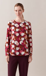 Redcliffe luxurious Italian silk crepe de chine crew neck gathered long cuff sleeve blouse in rhubarb red, berry and crème ivory white graphic geometric print