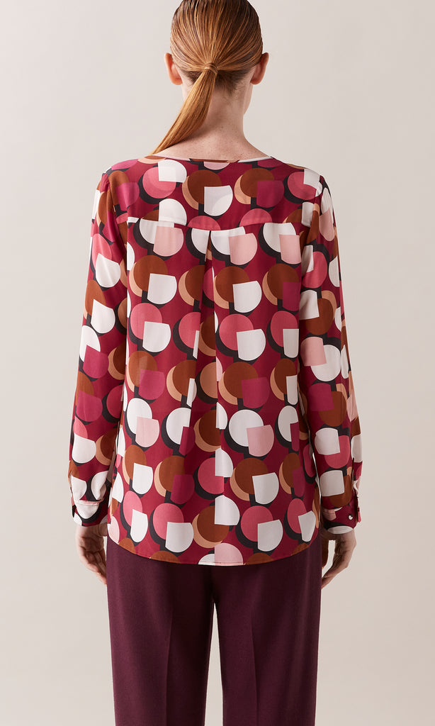 Redcliffe luxurious Italian silk crepe de chine crew neck gathered long cuff sleeve blouse in rhubarb red, berry and crème ivory white graphic geometric print