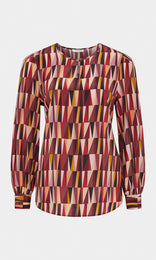 Pyramid Italian pure silk crepe de chine crew neck gathered long wide cuff sleeve blouse with neck keyhole opening in rhubarb red, berry, and peach orange geometric print design